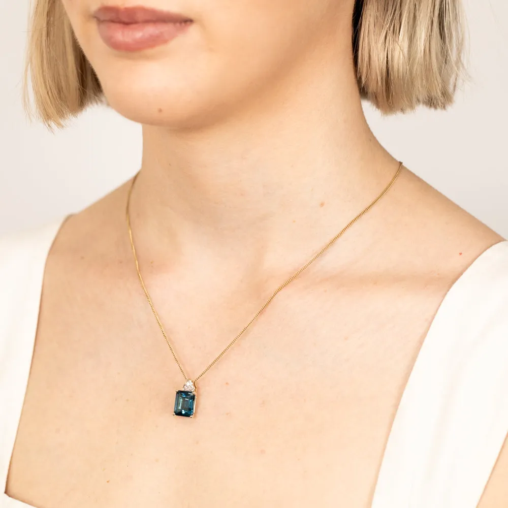 9ct Gold 5.6ct London Blue Topaz in Emerald Cut and 1/10 Carat Diamond Pendant Shiels